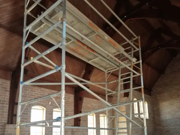Scaffold tower erected inside a heritage brick building for an interior access job in Bunbury