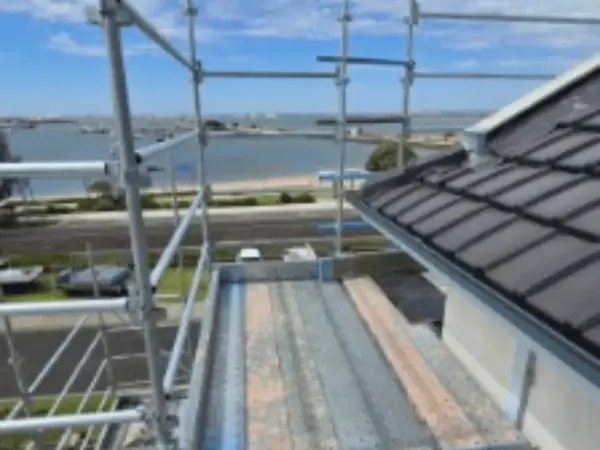 Kwikstage scaffold platform along a roof edge during a re-roofing job in Bunbury, overlooking the foreshore