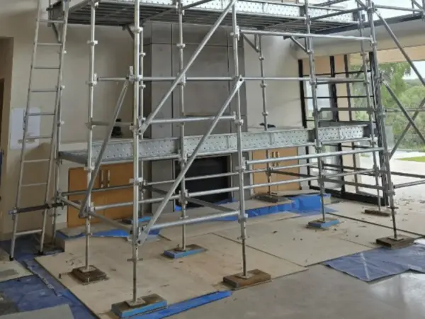 Birdcage scaffold platform set up inside an open-plan home under construction in Cowaramup