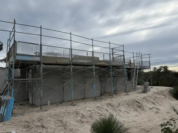 Edge protection scaffold platform on a coastal Eagle Bay building site
