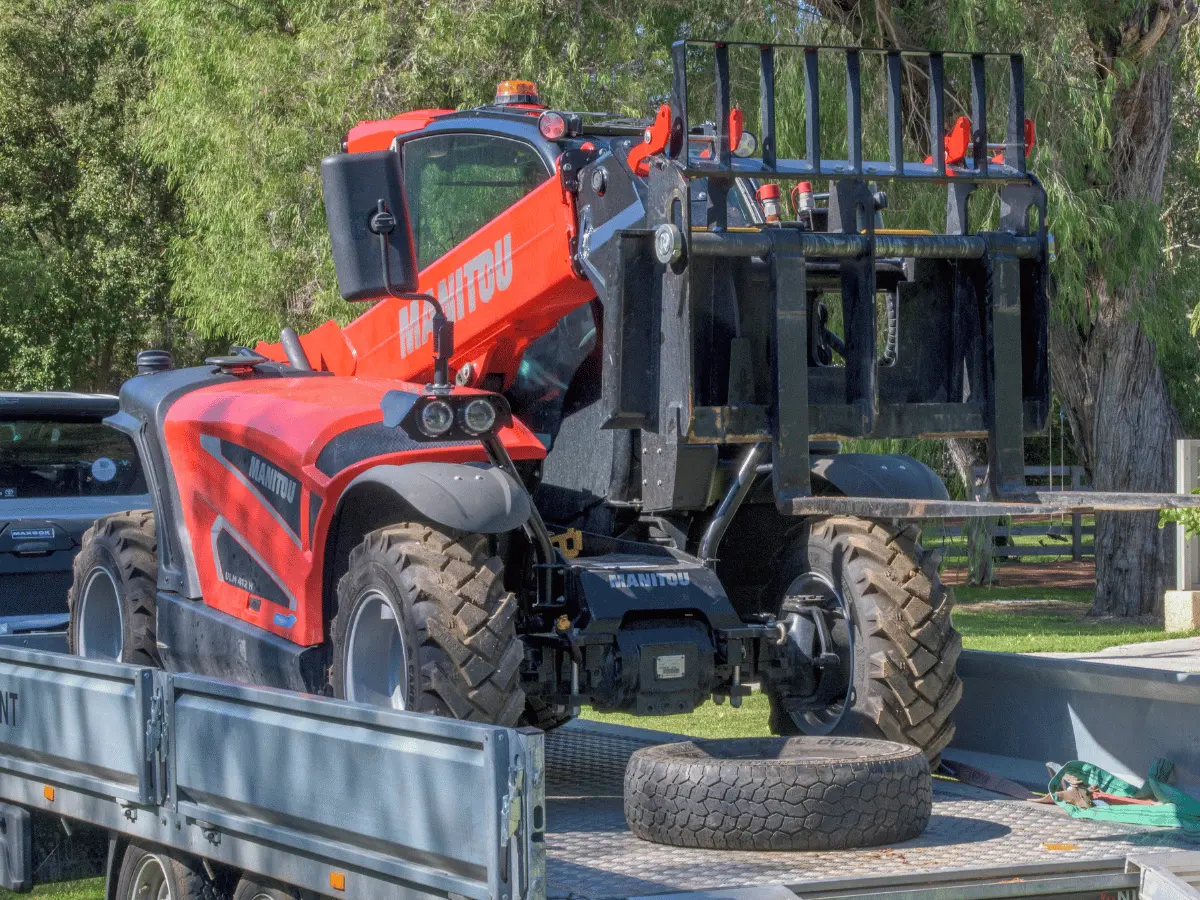 Southwest Compact Telehandler Service operator lifting materials on a restricted-access site