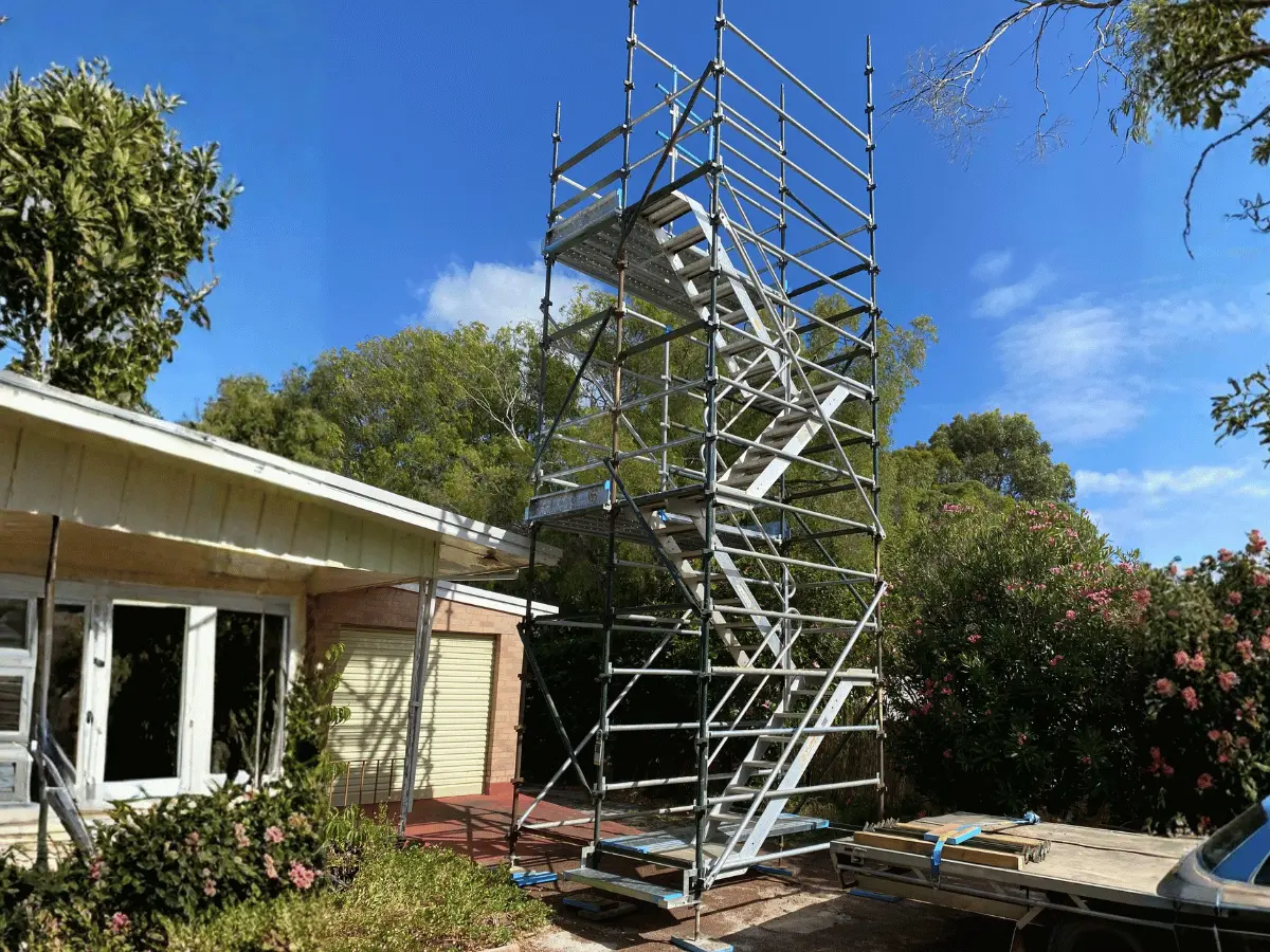 Freestanding viewing tower with staircase access on a construction site