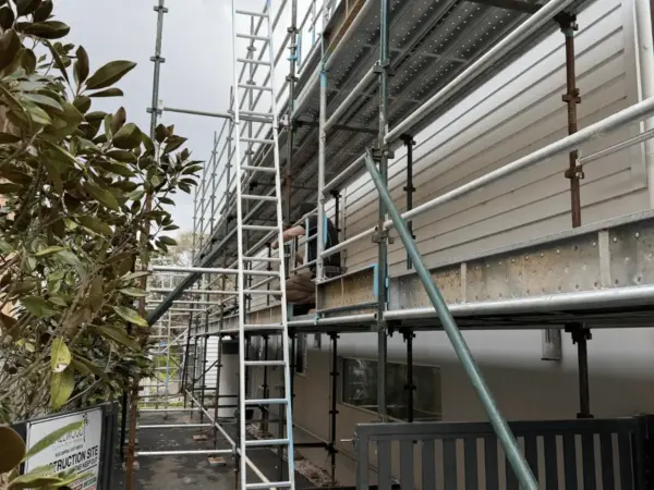 Scaffold along the side of a rendered building on an active Margaret River construction site
