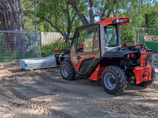 Bay Scaffold telehandler with enclosed cab on a sandy Yallingup site